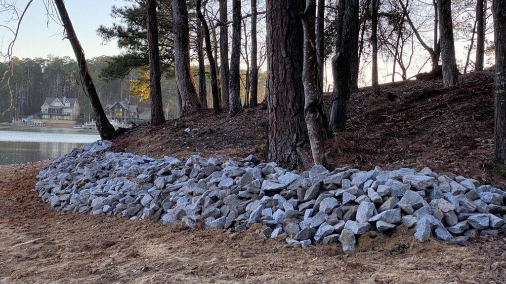 Rip rap seawall made of large stones along the shoreline, offering natural protection and enhancing the waterfront landscape.